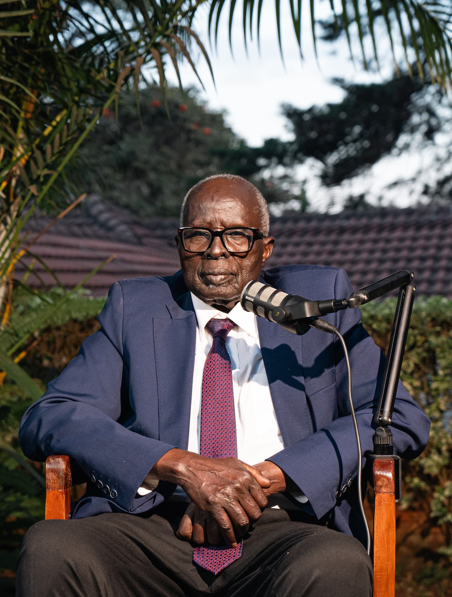 Dr. Aldo Ajou Deng-Akuey at the boom microphone mid-sentence.